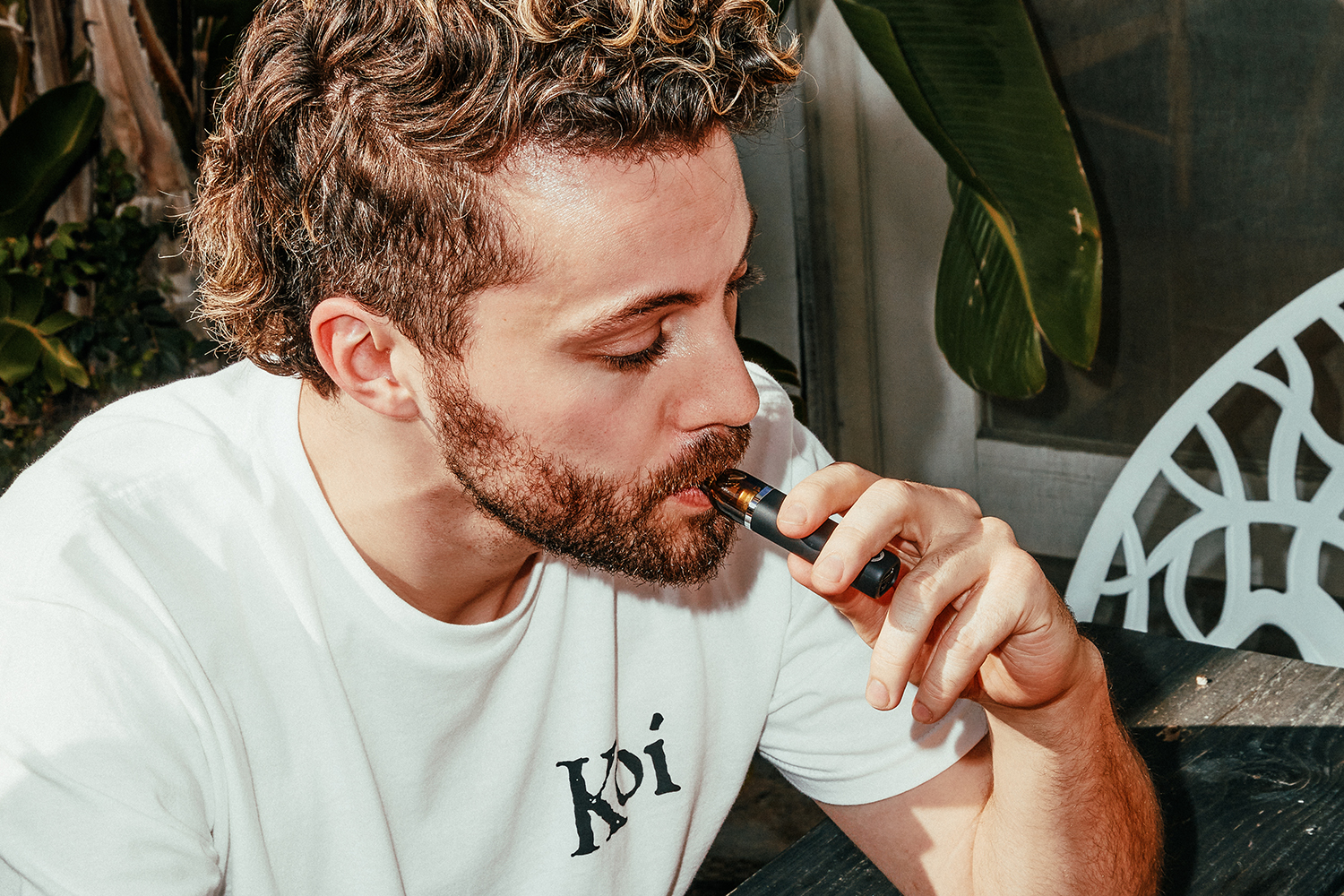 Man vaping a CBD vape disposable